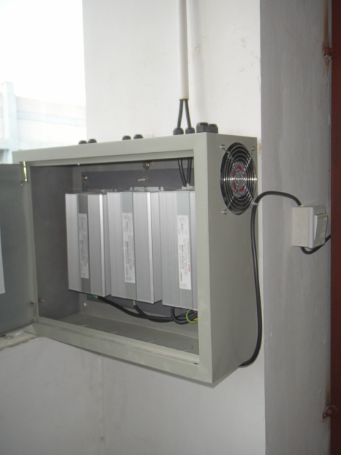 Base-mounted controller cabinet with plug-in modules, installed at ground level